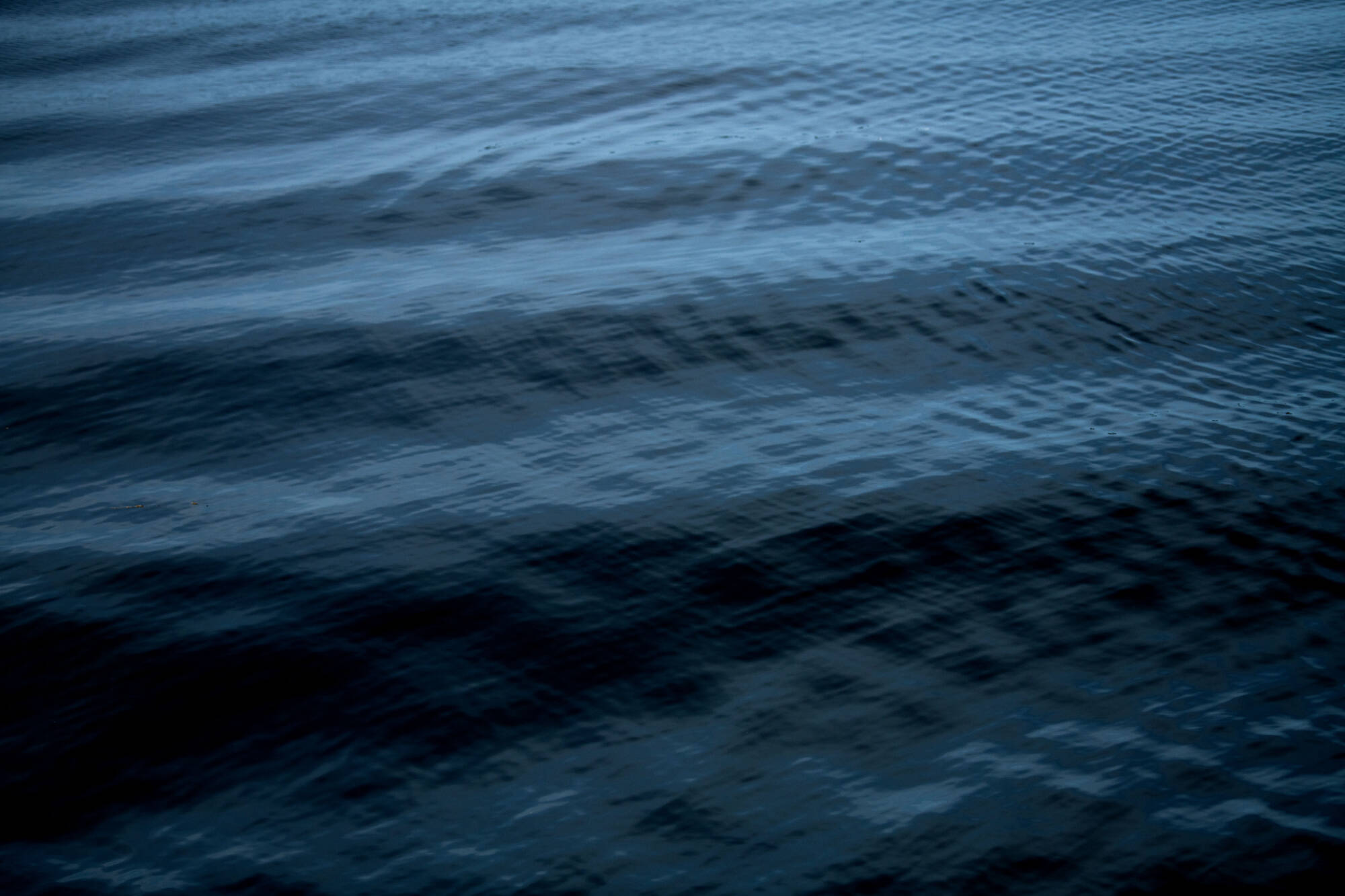 Close up of dark blue water with ripples